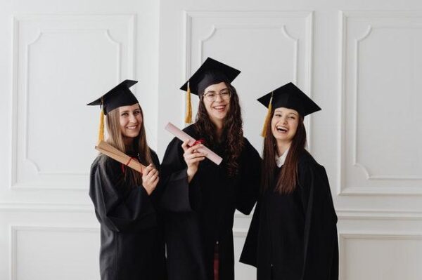 Happy Women In Academic Dresses