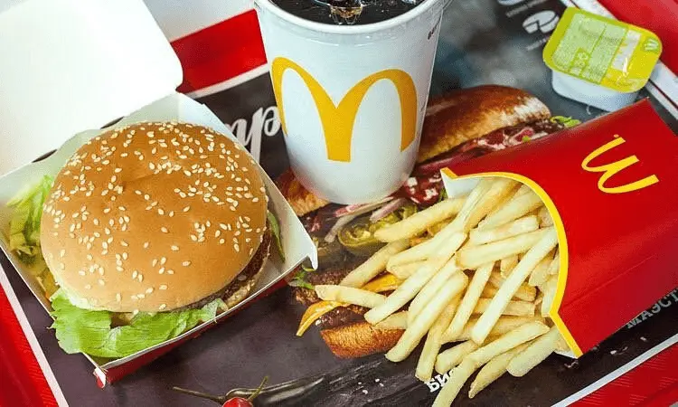 Who owns McDonald’s Corporation, the world’s largest fast-food chain?