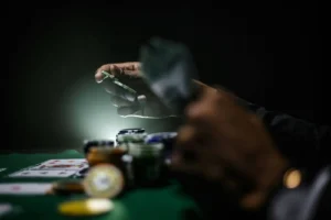 A man playing poker with poker chips and cards